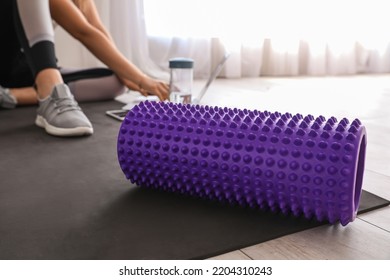 Foam Roller On Fitness Mat In Room, Closeup