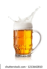 Foam Splash In The Faceted Beer Mug Isolated On White Background