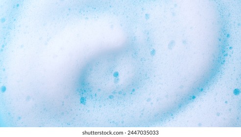 Foam swirl background. Liquid soap bubbles, Froth bubbles backdrop. Soap foam white backdrop. Soap sud macro structure close-up. Clean, cleaning, washing, laundry. Top view. 