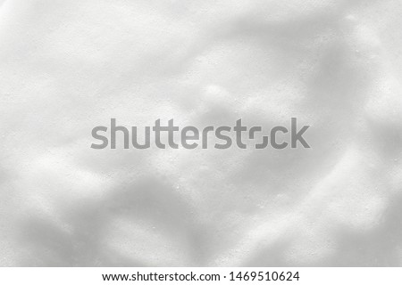 Foam texture background. Cosmetic soap, cleanser, shampoo bubbles. Macro, top view