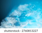 Foam texture close up, border design on blue background. Liquid soap bubbles, Soap foam bubbles background, popping bubble, backdrop. Soap sud macro structure. Soap foam close-up. Clean, cleaning, washing 