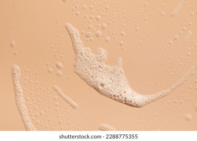 Foam texture on a pink background. A sample of facial foam.  - Shutterstock ID 2288775355