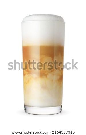 Foamy latte coffee and milk drink in a transparent glass isolated on white background.