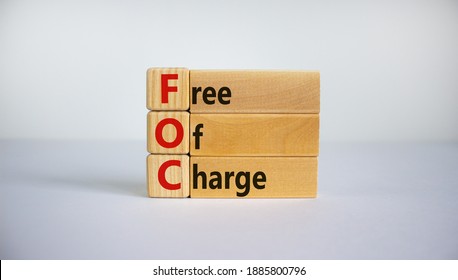 FOC - Free Of Charge Symbol. Concept Words 'FOC - Free Of Charge' On Wooden Cubes And Blocks On A Beautiful White Background. Business And FOC - Free Of Charge Concept. Copy Space.