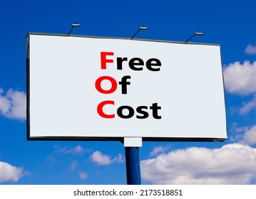 FOC Free Of Cost Symbol. Concept Words FOC Free Of Cost On Big White Billboard Against Beautiful Blue Sky And White Clouds. Business And FOC Free Of Cost Concept. Copy Space.