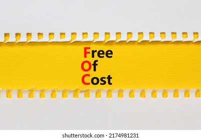 FOC Free Of Cost Symbol. Concept Words FOC Free Of Cost On Yellow Paper On A Beautiful White Background. Business And FOC Free Of Cost Concept. Copy Space.