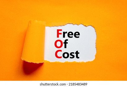 FOC Free Of Cost Symbol. Concept Words FOC Free Of Cost On White Paper On A Beautiful Orange Background. Business And FOC Free Of Cost Concept. Copy Space.