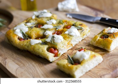 Focaccia with cherry tomatoes, basil pesto and goats cheese - Powered by Shutterstock