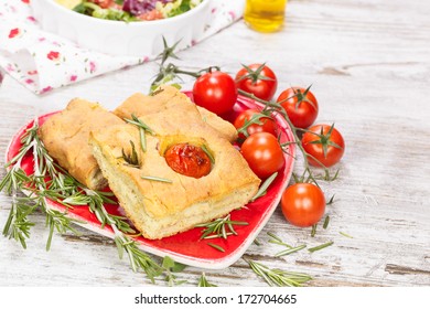 Focaccia.  Focaccia italian bread slices with tomato and rosemary. 