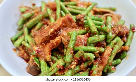 Focal Focus Of Thai Dish Stir Fried Pork  Belly With Red Curry Paste And Sting Beans, Tasty And Spicy Famous Icon. Meat Can Be Seafood, Pork, Chicken, Beef Depends On The Order And Favor