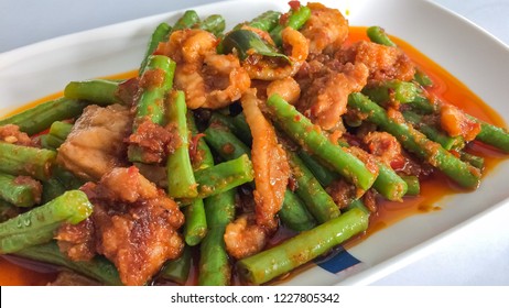 Focal Focus Of Thai Dish Stir Fried Pork Belly With Red Curry Paste And Sting Beans, Tasty And Spicy Famous Icon. Meat Can Be Seafood, Pork, Chicken, Beef Depends On The Order And Favor