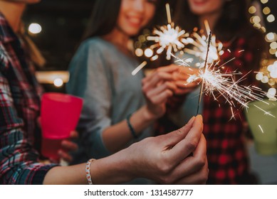 Focus bengal light which women keeping. Ladies having new year party Foto Stock