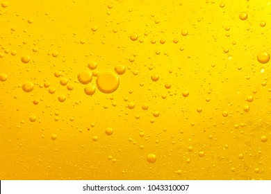 Focus boiling yellow oil spread widely bubble texture full frame and macro many various droplets