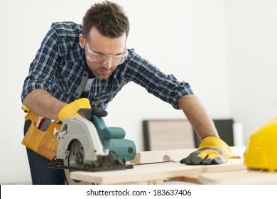 Focus Carpenter Sawing Wood Board