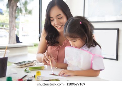 focus happy face of asian mother do painting with kids. - Powered by Shutterstock