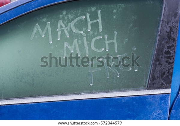 Focus of the\
image so wanted. Recording so desired.\
Frozen car window with a\
message text in German, make me\
free.