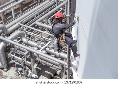 Focus Male Worker Using Rope Access Of Inspection Storage Tank