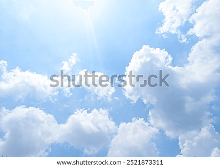 Focus on clouds. The sky was bright blue with pure white clouds like soft cotton.Full frame shot. Heaven sky bright Blue sky background. Other similar photos
