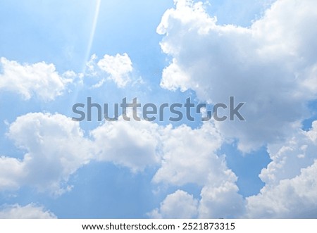 Focus on clouds. The sky was bright blue with pure white clouds like soft cotton.Full frame shot. Heaven sky bright Blue sky background. Other similar photos