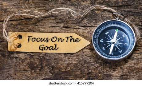 Focus on the goal - Motivation handwriting on label with compass - Shutterstock ID 415999204