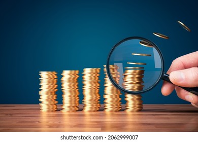 Focus on growing inflation concept. Growing columns of coins, coins fade away from the last column what represents inflation. Post-covid economic consequence. - Shutterstock ID 2062999007