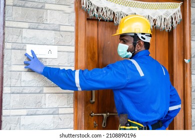 Focus On Hand, Plumber With Medical Face Mask At Customer Home For Servicing - Concept Of Home Plumbing Repair And Maintenance Service With Covid-19 Or Coronavirus Safety Measures During Pandemic.