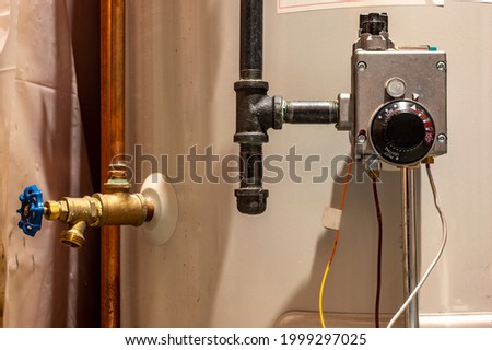 Focus on heating controls of a hot water heater with base plate on