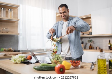 Focus On Man's Hands Holding Wooden Spoons And Mixing Ingredients In A Glass Bowl, Preparing Delicious Healthy Breakfast Or Dinner In The Modern Kitchen Island.