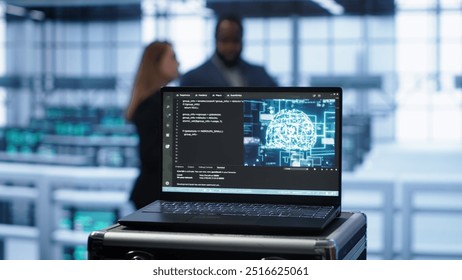 Focus on notebook used by engineers in server hub in blurry background using artificial intelligence computerized model. Close up of laptop with AI deep learning using pattern recognition, camera A