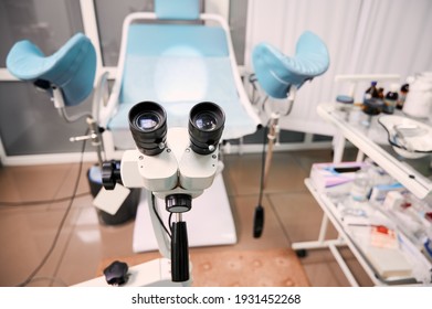 Focus on optical instrument for colposcopy in gynecological cabinet. Empty gynecology office with modern colposcope and medical tools. Concept of gynecology, obstetrics and medical equipment. - Shutterstock ID 1931452268