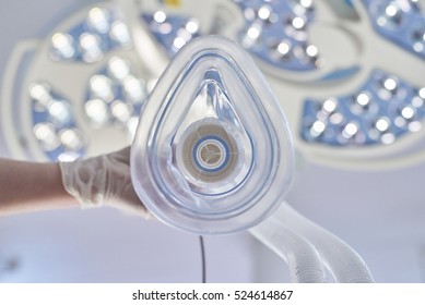 Focus on an oxygen mask in an operating theatre. Personal perspective of doctors administering oxygen color processed - Shutterstock ID 524614867
