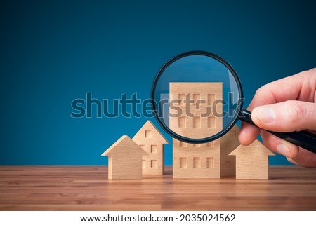 Focus on real estate and property insurance concept. Wooden models of different types of houses