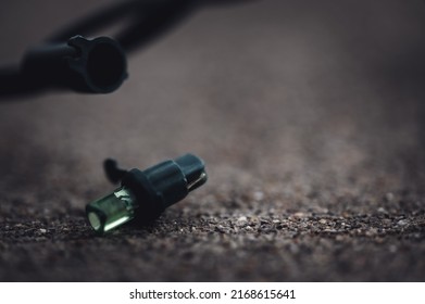 Focus on replacement bulb for a string of Christmas lights to repair a dud.  - Shutterstock ID 2168615641