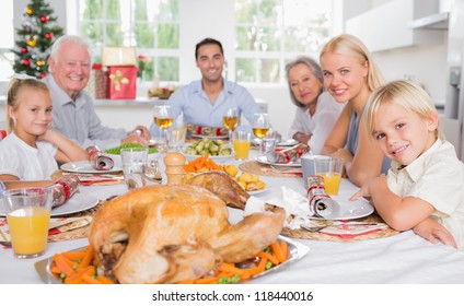 Focus On The Roast Turkey In Front Of Family At Chrismas Dinner