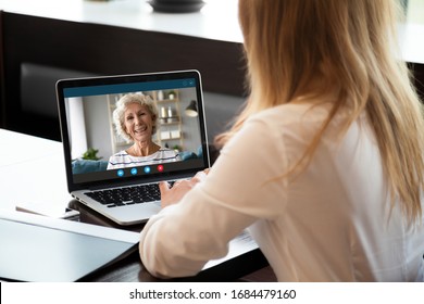 Focus on screen with happy middle aged hoary woman making video call with grown up young daughter woman, chatting communicating online using computer application, staying at home at quarantine. - Powered by Shutterstock