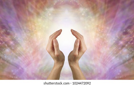 Focus on sending pure unconditional love healing energy- female hands in cupped position against a beautiful feminine gold shimmering sparkle background depicting unconditional love