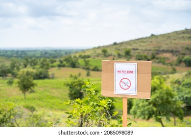 Focus on Sign board, No fly zone Sign board on top of Hill - concept of drone restrictive zones