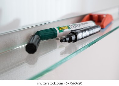 Focus on the whiteboard markers.