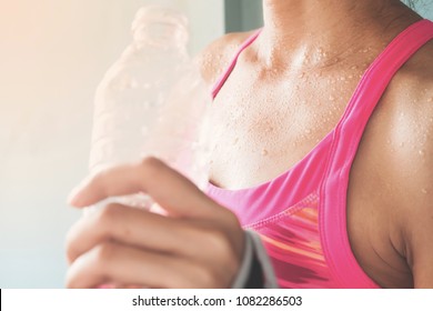 Focus on woman's body with sweat on tanning skin, Healthy lifestyle - Shutterstock ID 1082286503