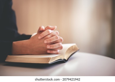 focus on woman's hand While praying for Christianity with blurry body background, praying with her hands with scriptures. - Shutterstock ID 2079421942
