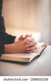 focus on woman's hand While praying for Christianity with blurry body background, praying with her hands with scriptures. - Shutterstock ID 2080033258