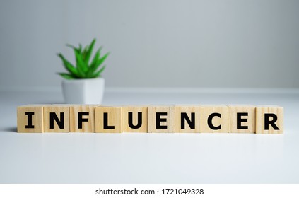 focus on wooden blocks with letters making Influencer text. - Shutterstock ID 1721049328