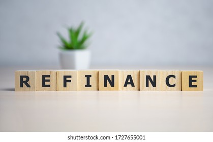focus on wooden blocks with letters making Refinance text. - Shutterstock ID 1727655001