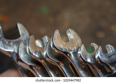 Focus set on tools in a workshop. Keys located on the background - table
