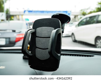 Focus Smart Phone Holder In Car On Blur Background With Copy Space