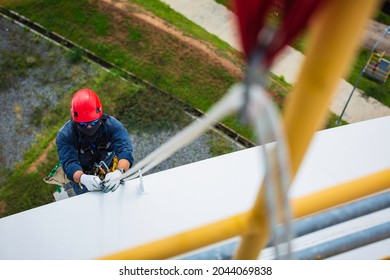 Focus Top View Male Worker Down Carabiner Rope Height Tank Roof Knot Handrail Rope Access Safety Inspection Of Thickness Storage Tank Roof.