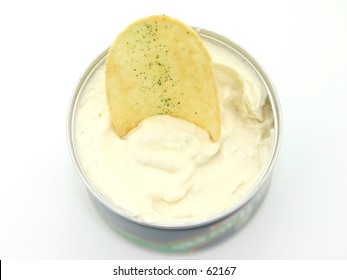 Focus Where Chip Meets The Dip.  Sour Cream And Onion Chip In French Onion Dip.