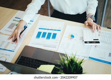 focus woman holding a pencil Auditors use budget document calculators to find annual budget disbursement errors. - Powered by Shutterstock - Get 15% off with code: PIKWIZARD15