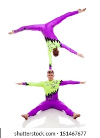 Focused Acrobats Balancing, Isolated On White