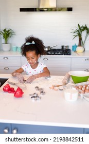 Focused African American Messy Girl Baking In Kitchen. Baking And Cooking, Childhood And Leisure Time At Home.